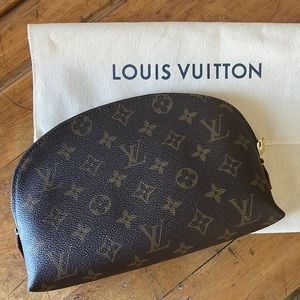 Louis Vuitton monogram canvas cosmetic pouch gm. Never been used. W/ duster bag.